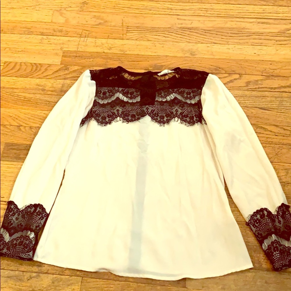 Cream shirt with black lace trim